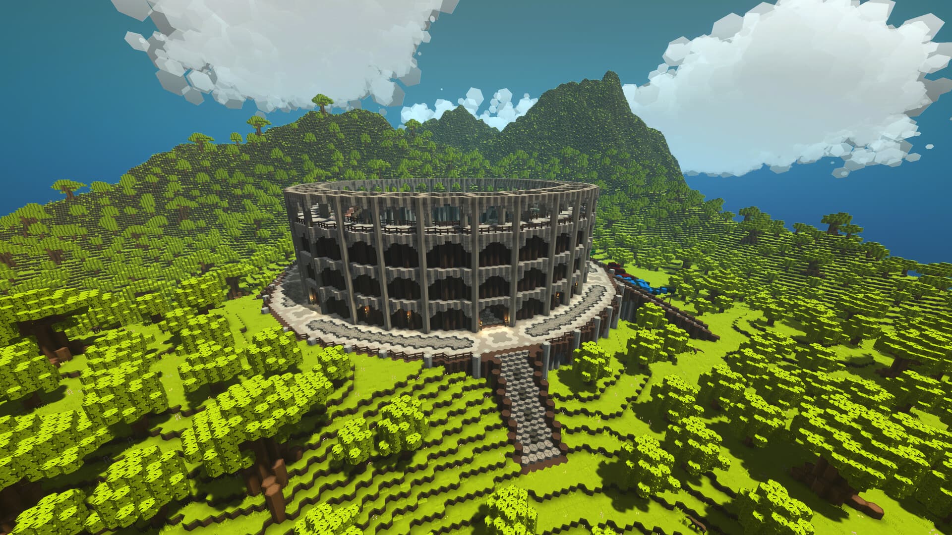 A colosseum-style arena built into a mountainside